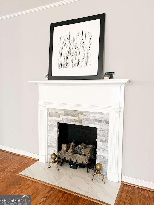 room details featuring hardwood / wood-style flooring and crown molding