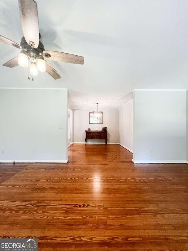 interior space with ceiling fan and hardwood / wood-style flooring