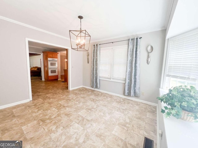 unfurnished room with ornamental molding and an inviting chandelier