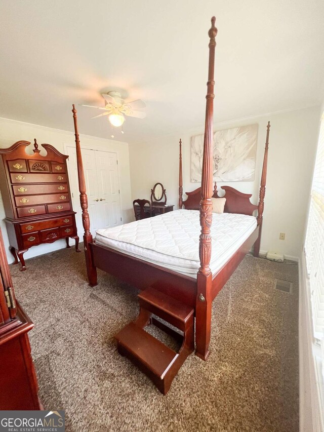 bedroom featuring a closet, ceiling fan, and carpet