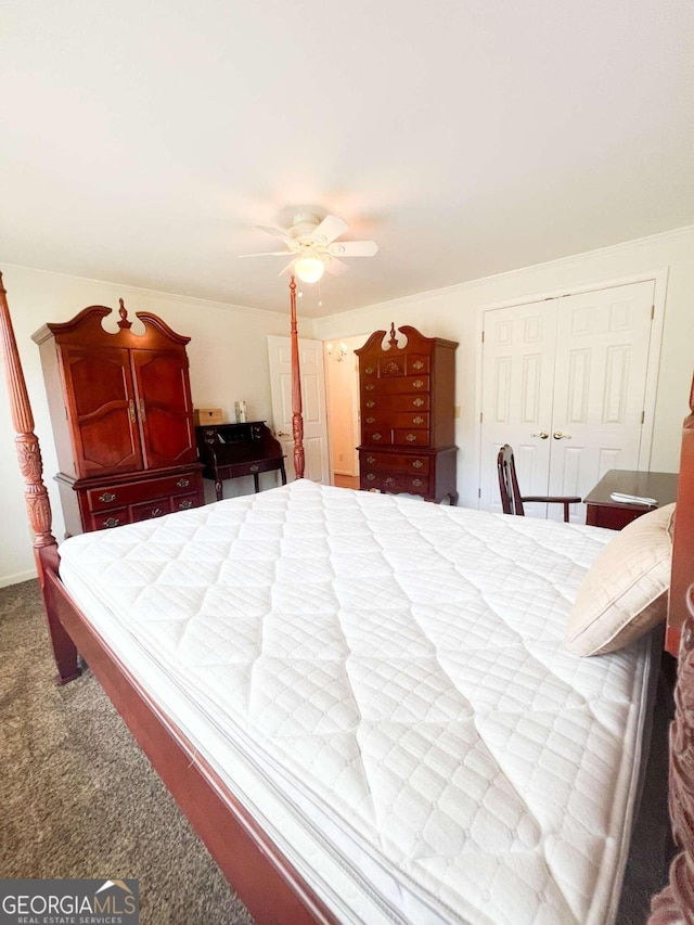 carpeted bedroom featuring ceiling fan and a closet