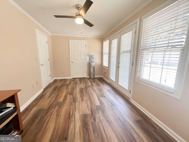 interior space featuring ornamental molding, french doors, ceiling fan, and dark hardwood / wood-style floors