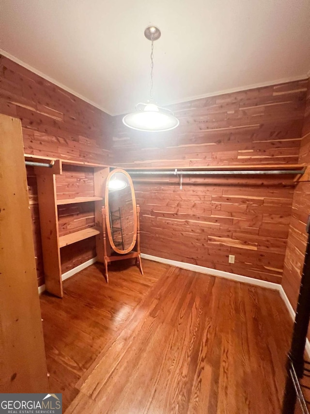 spacious closet featuring hardwood / wood-style floors