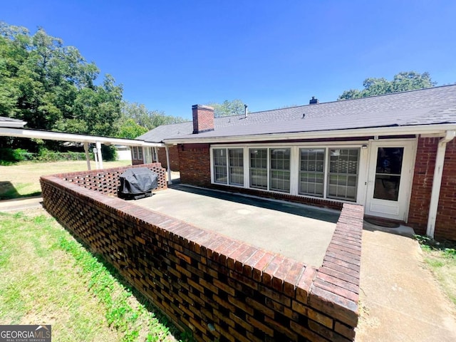 wooden terrace with a patio