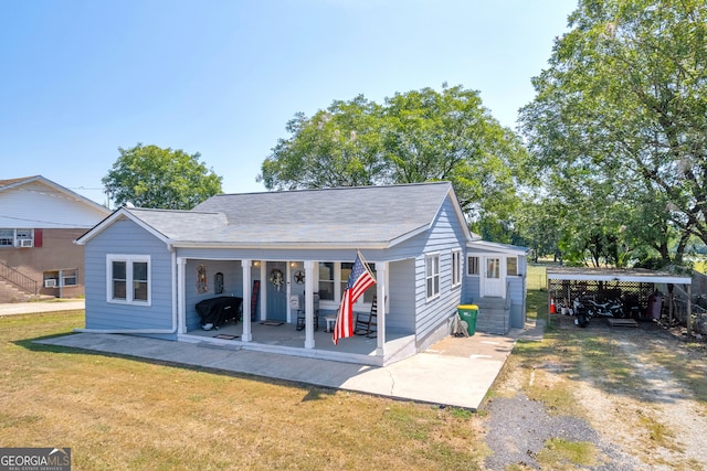 rear view of house featuring a yard and a carport