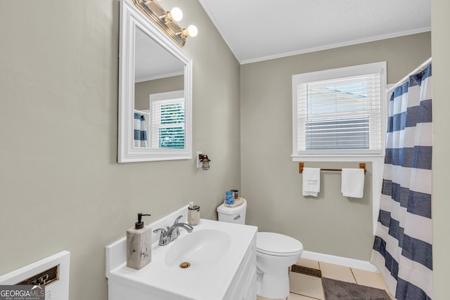 bathroom with vanity, toilet, plenty of natural light, and tile patterned flooring