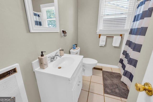 bathroom with vanity, toilet, a shower with curtain, and tile patterned floors