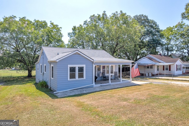 exterior space featuring a lawn and a patio area