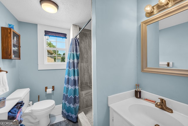 bathroom featuring a shower with shower curtain, a textured ceiling, tile patterned floors, toilet, and vanity