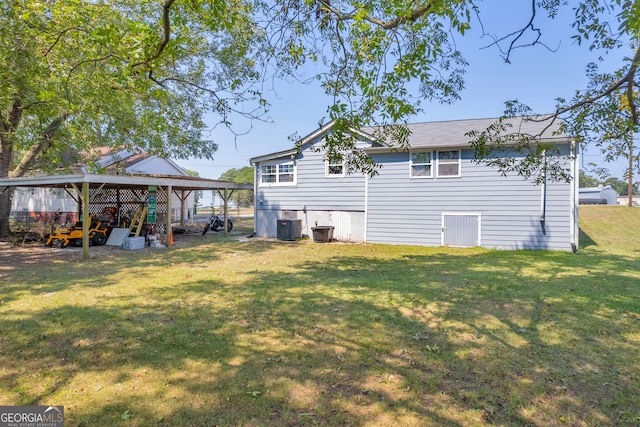 back of house with a lawn and central AC unit