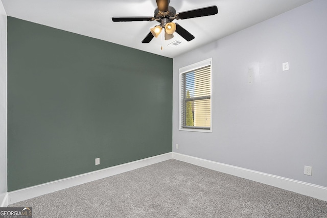 unfurnished room featuring carpet and ceiling fan