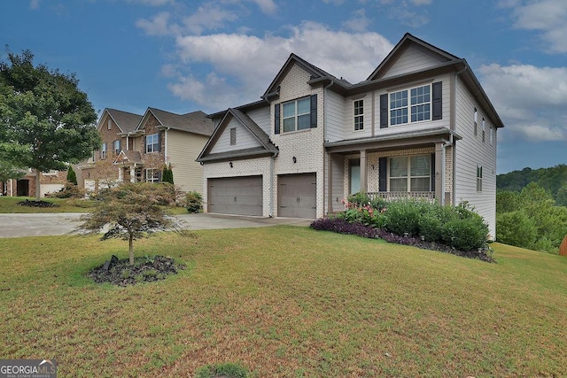 view of front of property featuring a front yard and a garage