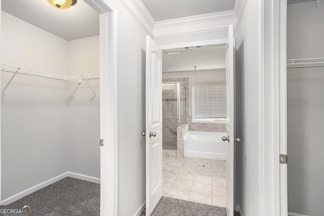 bathroom with tile patterned flooring and independent shower and bath