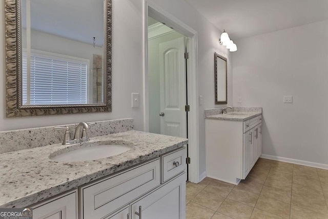 bathroom featuring tile patterned flooring and vanity