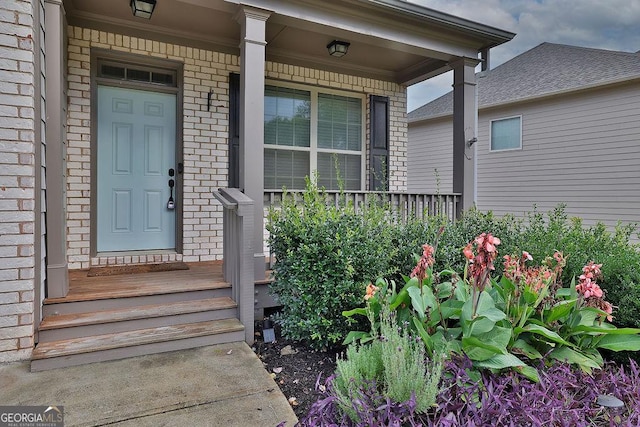 doorway to property featuring covered porch