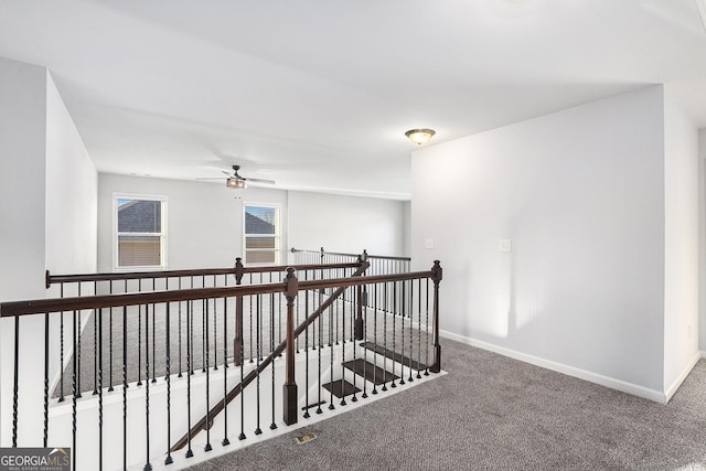 hallway with carpet flooring