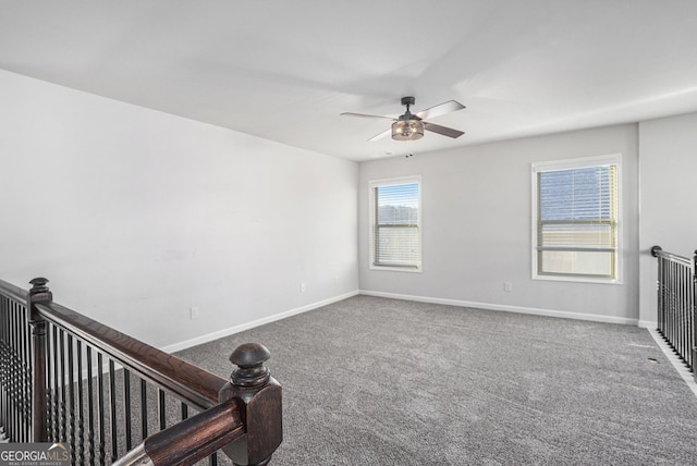 unfurnished room featuring carpet floors and ceiling fan