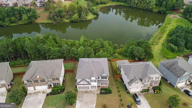 birds eye view of property featuring a water view