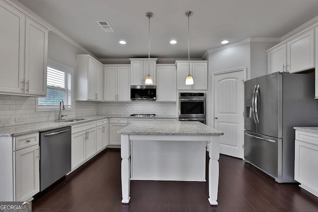 kitchen with dark hardwood / wood-style floors, decorative light fixtures, light stone counters, white cabinetry, and stainless steel appliances