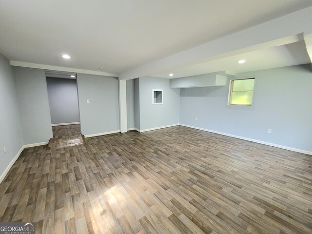 basement featuring light hardwood / wood-style flooring