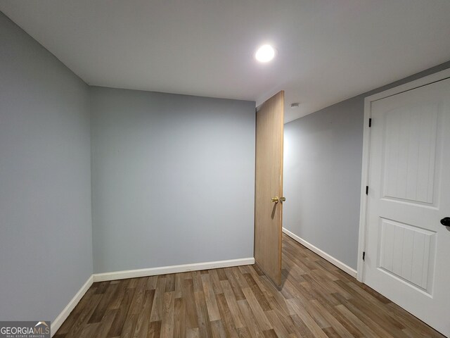 empty room featuring hardwood / wood-style flooring