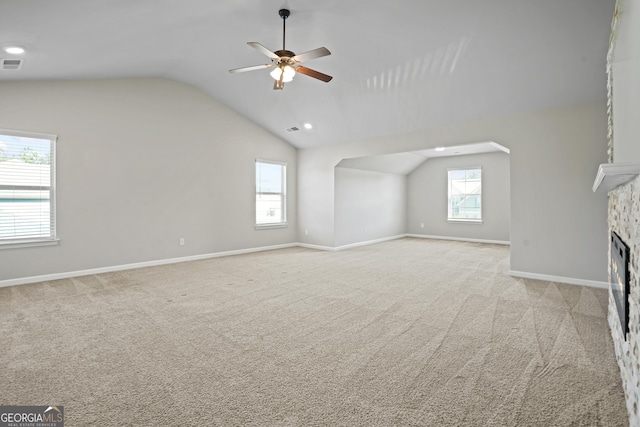 bonus room featuring baseboards, visible vents, lofted ceiling, a fireplace, and carpet flooring