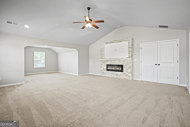 unfurnished living room featuring lofted ceiling, carpet, and visible vents