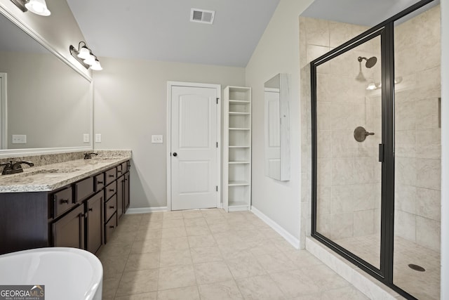 full bathroom featuring a shower stall, double vanity, visible vents, and a sink