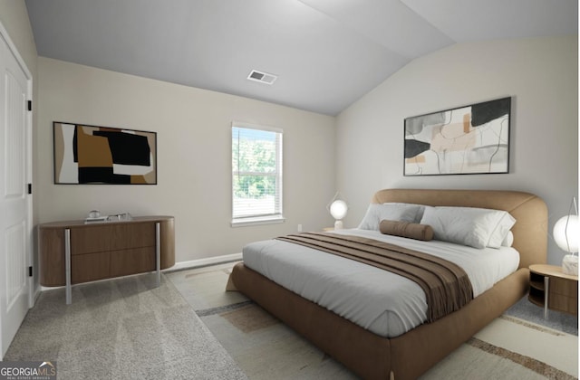 bedroom featuring visible vents, carpet floors, and vaulted ceiling