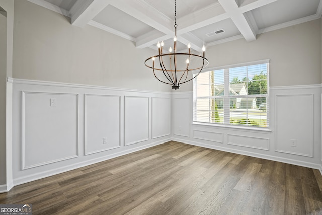 unfurnished dining area with visible vents, beam ceiling, wood finished floors, and a decorative wall