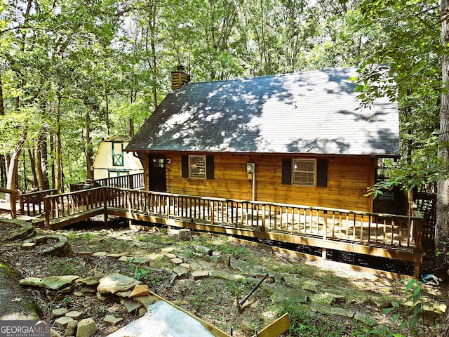 exterior space featuring a wooden deck