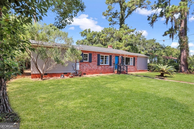 ranch-style house featuring a front yard