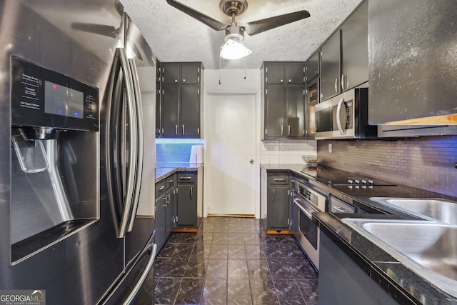 kitchen with ceiling fan, appliances with stainless steel finishes, tasteful backsplash, and a textured ceiling