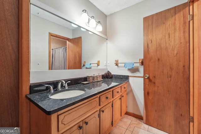 bathroom featuring tile patterned floors and vanity