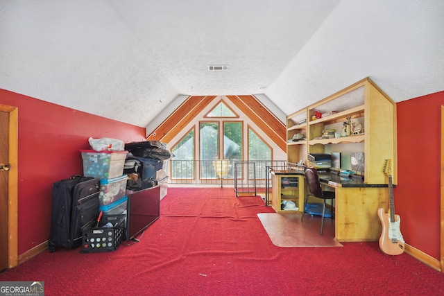 rec room with lofted ceiling, a textured ceiling, and carpet floors