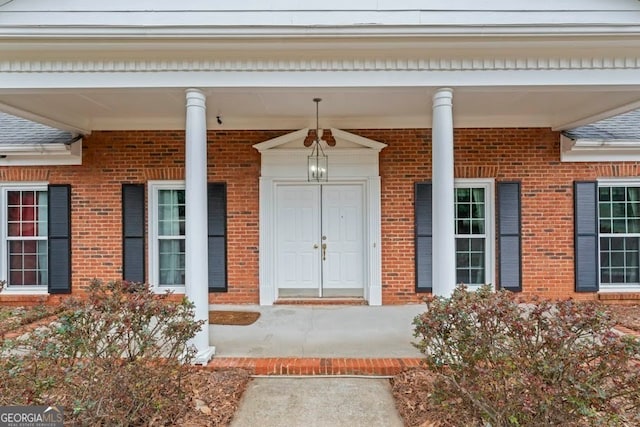 doorway to property with covered porch