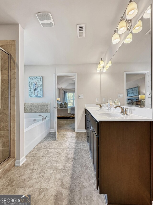 bathroom with vanity and a shower with shower door