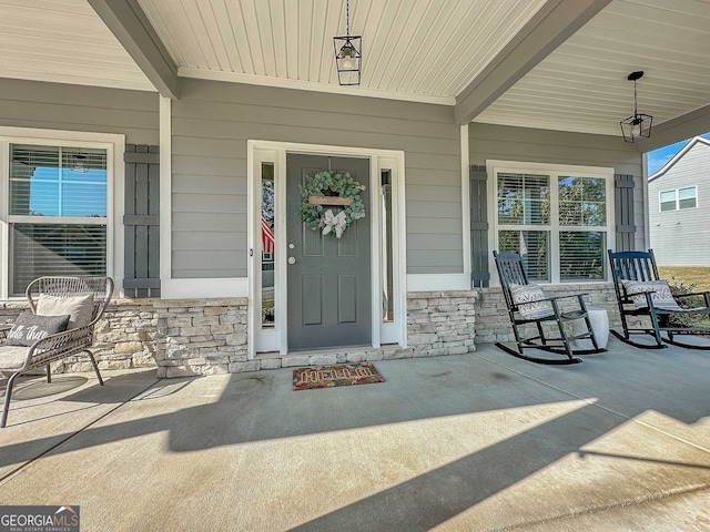 entrance to property with a porch