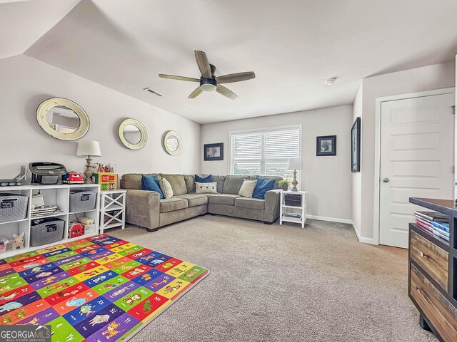 game room with vaulted ceiling, ceiling fan, and carpet flooring