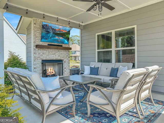 rear view of property with a lawn, ceiling fan, and a patio area