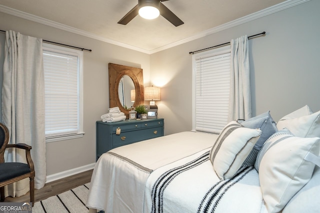 bedroom featuring ceiling fan, dark hardwood / wood-style flooring, and ornamental molding