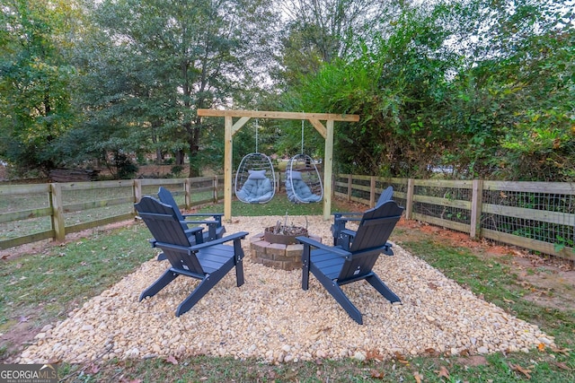 view of yard featuring an outdoor fire pit