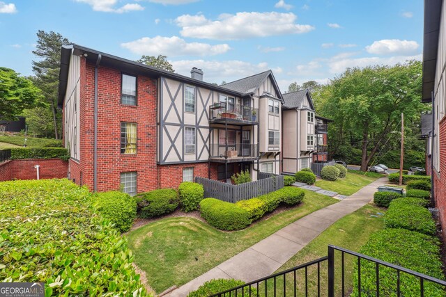 view of front of house featuring a balcony