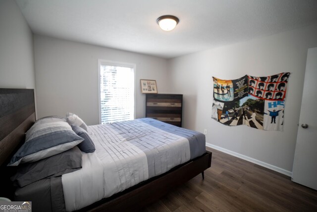 bedroom featuring dark hardwood / wood-style floors