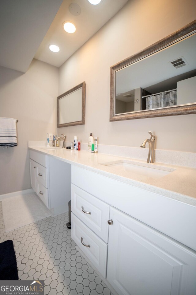 bathroom with vanity and tile patterned floors