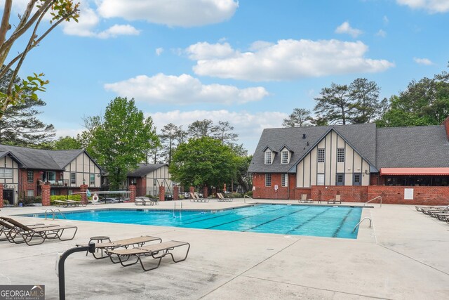 view of pool featuring a patio