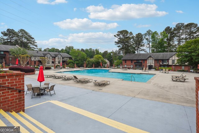 view of pool featuring a patio