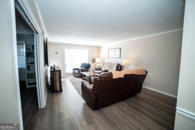 living room with ornamental molding and dark wood-type flooring