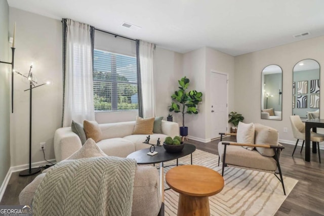 living room with dark hardwood / wood-style floors