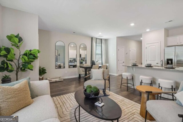 living room with dark hardwood / wood-style floors